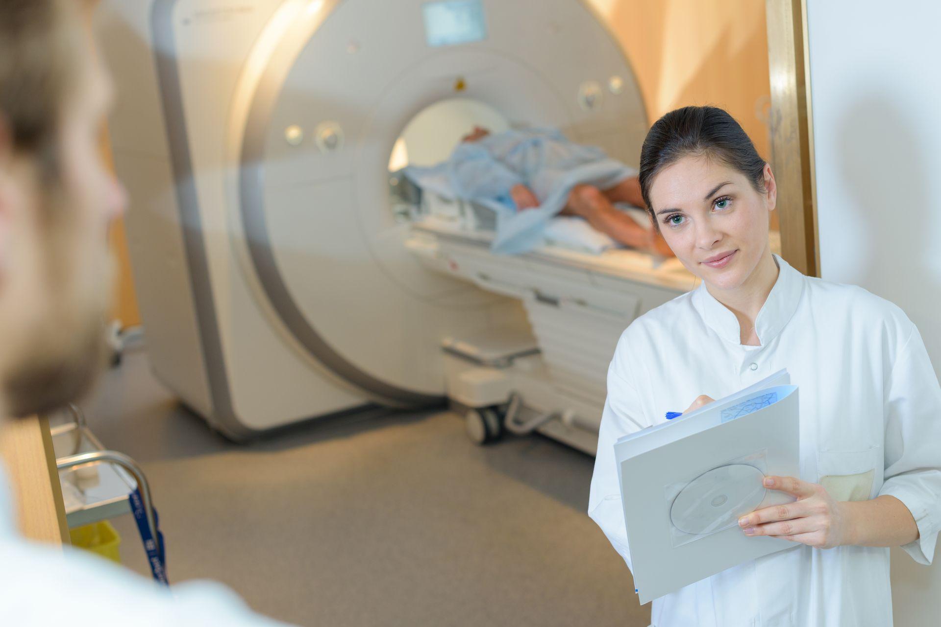 lady in MRI room with notepad
